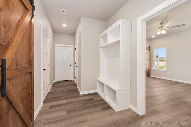 mudroom featuring visible vents, baseboards, a ceiling fan, and wood finished floors
