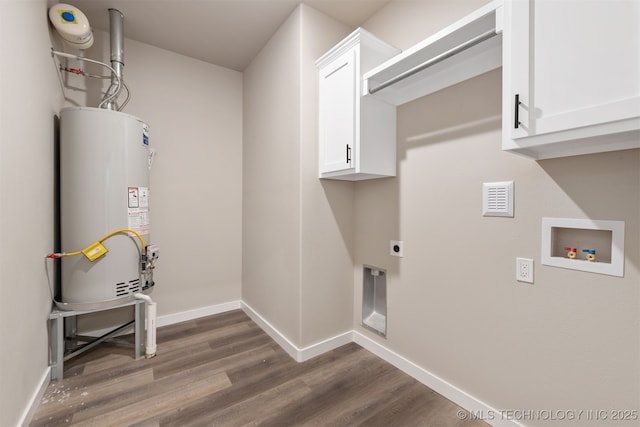 laundry area featuring electric dryer hookup, dark wood-style floors, washer hookup, gas water heater, and cabinet space