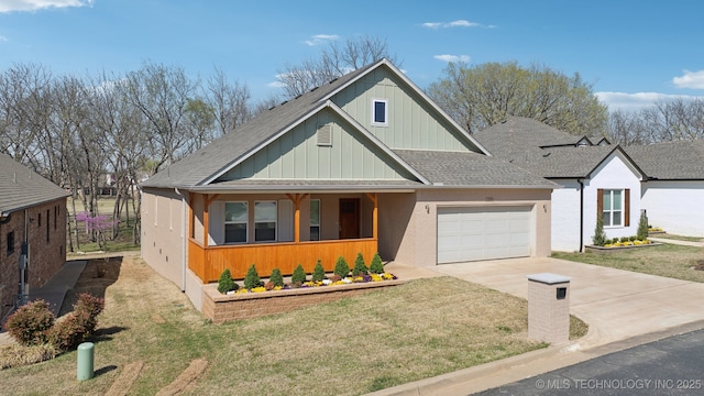 3306 Harbour Town Pl, Claremore, OK 74019 - view of front facade with a shingled roof, a front yard, a garage, and concrete driveway