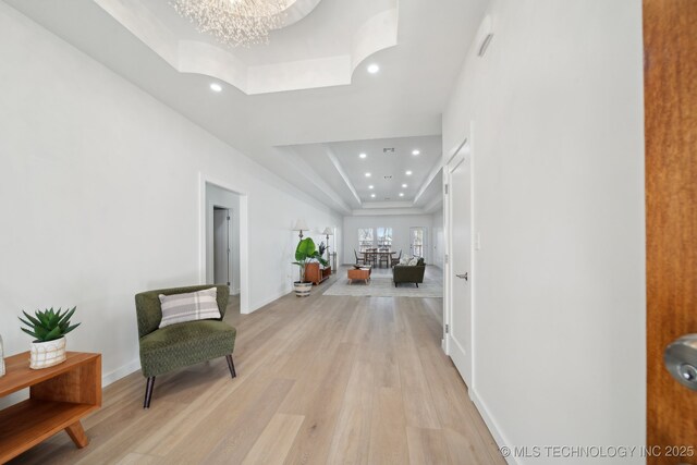 3306 Harbour Town Pl, Claremore, OK 74019 - corridor featuring an inviting chandelier, a raised ceiling, light wood-style floors, and recessed lighting