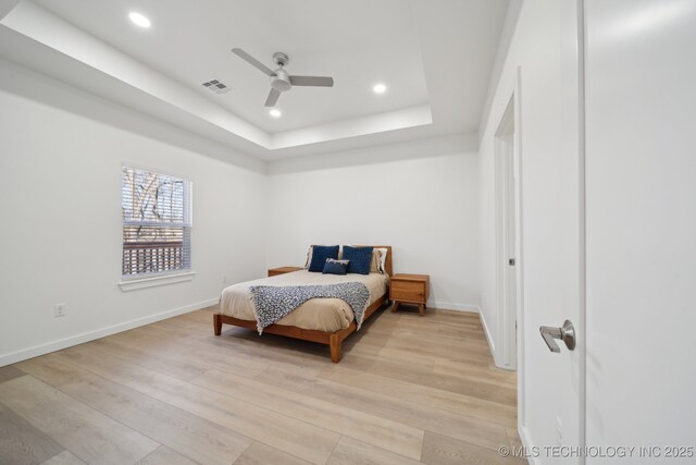 3306 Harbour Town Pl, Claremore, OK 74019 - bedroom featuring baseboards, light wood-type flooring, recessed lighting, and a raised ceiling