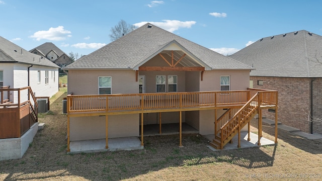 3306 Harbour Town Pl, Claremore, OK 74019 - back of house featuring a shingled roof, a deck, a patio area, and brick siding