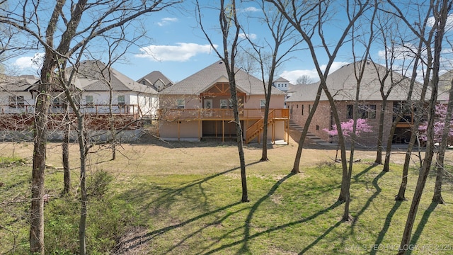 3306 Harbour Town Pl, Claremore, OK 74019 - view of yard featuring stairs, a wooden deck, and a residential view