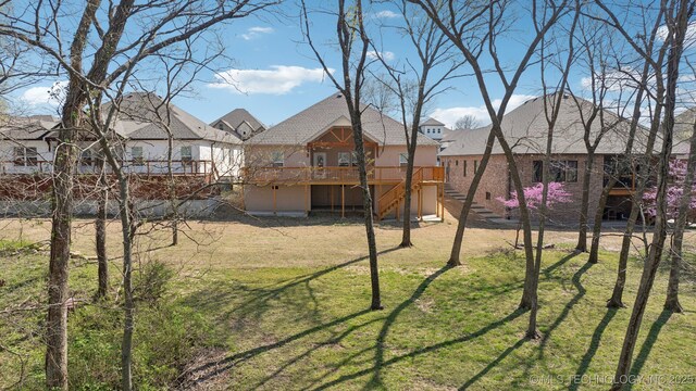 3306 Harbour Town Pl, Claremore, OK 74019 - view of yard with a residential view, a wooden deck, and stairway