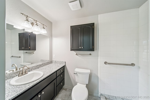 9839 N Lewis Ave, Sperry, OK 74073 - bathroom featuring vanity, baseboards, and toilet