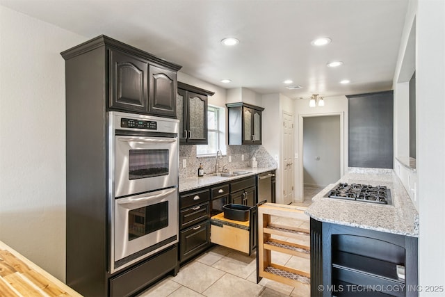9839 N Lewis Ave, Sperry, OK 74073 - kitchen featuring backsplash, stainless steel appliances, recessed lighting, and a sink