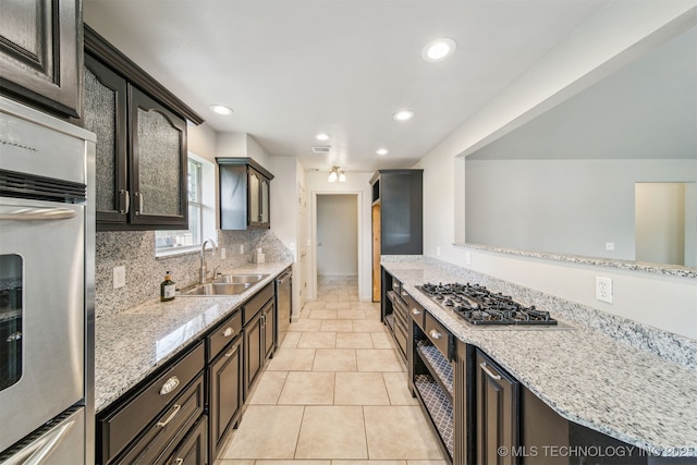 9839 N Lewis Ave, Sperry, OK 74073 - kitchen featuring a sink, appliances with stainless steel finishes, light stone countertops, and recessed lighting