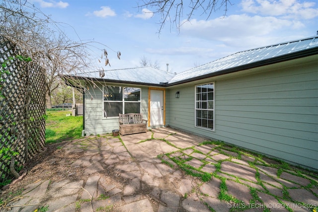 9839 N Lewis Ave, Sperry, OK 74073 - back of property featuring a patio area and metal roof