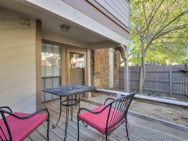 6510 S Memorial Dr Unit G, Tulsa, OK 74133 - wooden terrace with outdoor dining area and fence