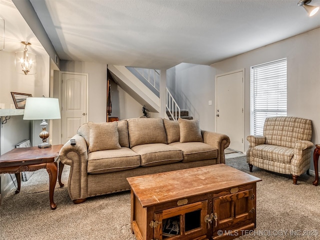 6510 S Memorial Dr Unit G, Tulsa, OK 74133 - living area featuring light colored carpet, stairs, and a textured ceiling