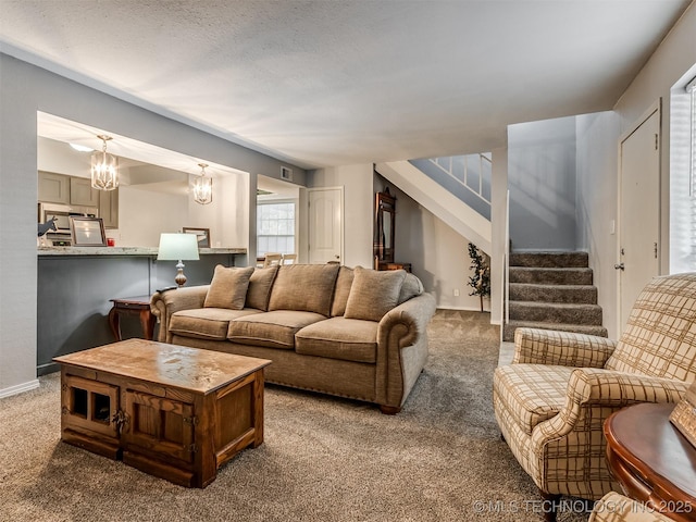 6510 S Memorial Dr Unit G, Tulsa, OK 74133 - living area with carpet flooring, a textured ceiling, visible vents, stairway, and a notable chandelier