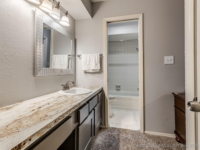 6510 S Memorial Dr Unit G, Tulsa, OK 74133 - full bath featuring washtub / shower combination, baseboards, toilet, vanity, and a textured wall