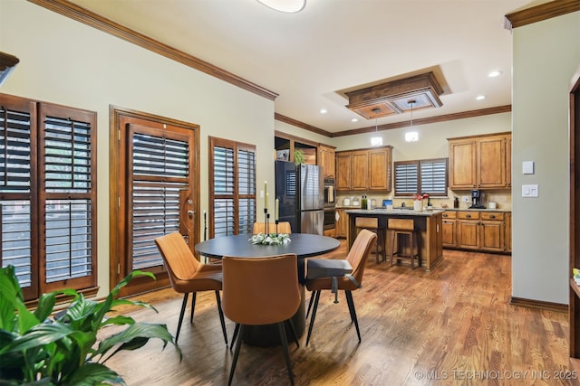 626 Countrywood Way, Sapulpa, OK 74066 - dining space with ornamental molding, wood finished floors, and recessed lighting