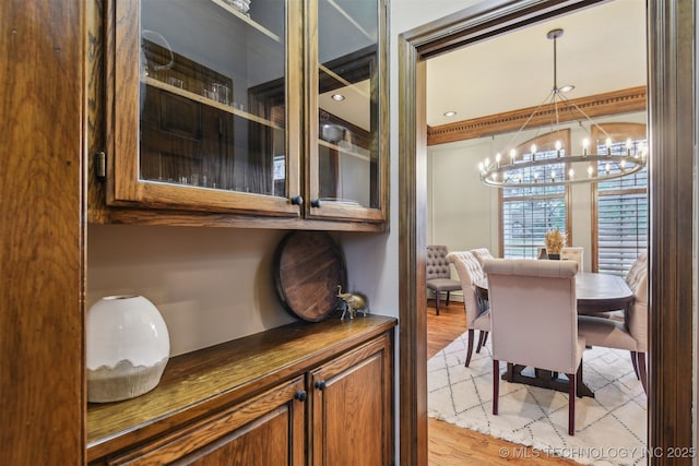 626 Countrywood Way, Sapulpa, OK 74066 - dining area with a chandelier and light wood-type flooring