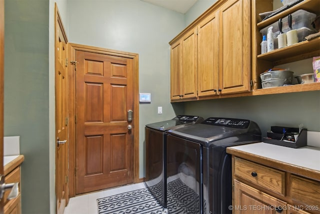 626 Countrywood Way, Sapulpa, OK 74066 - washroom featuring cabinet space, washing machine and clothes dryer, and light tile patterned floors