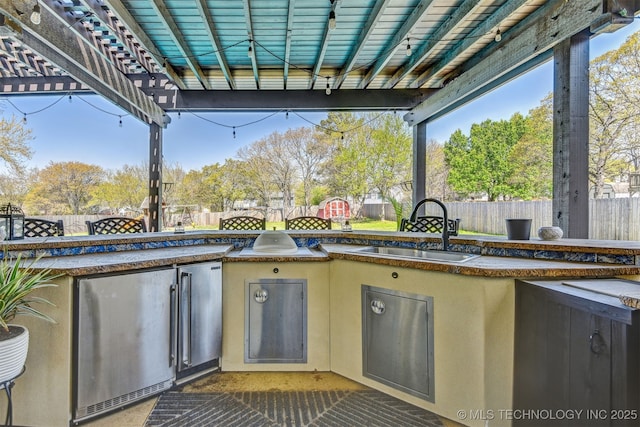 626 Countrywood Way, Sapulpa, OK 74066 - fenced backyard featuring a pergola and area for grilling