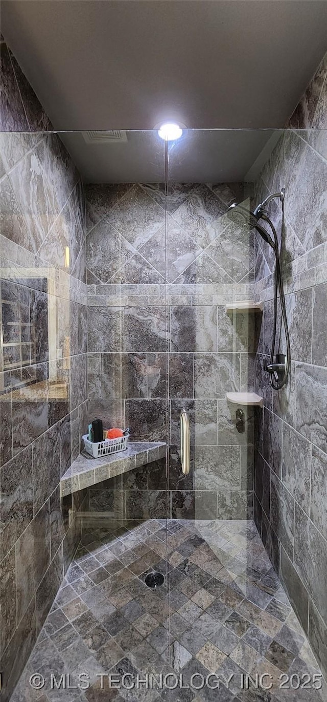 bathroom featuring a stall shower