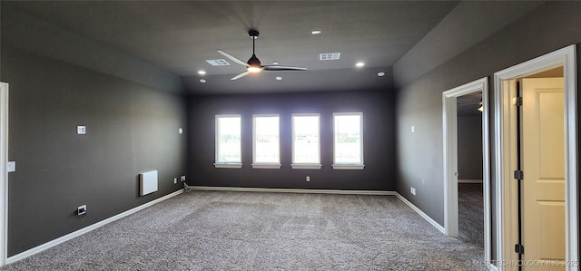 unfurnished bedroom featuring lofted ceiling, visible vents, carpet, and ceiling fan