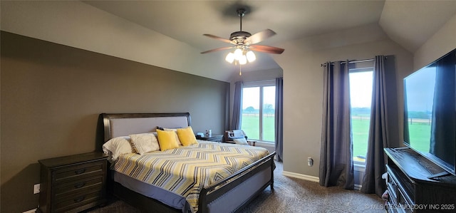 bedroom with ceiling fan, lofted ceiling, carpet flooring, and baseboards