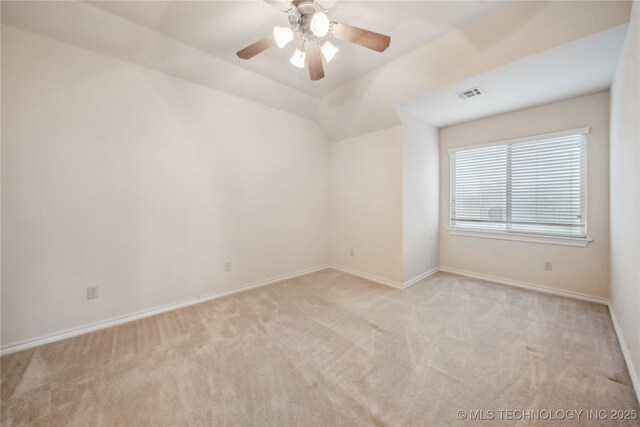 6673 E 60th Pl, Tulsa, OK 74145 - spare room featuring carpet floors, baseboards, a ceiling fan, and lofted ceiling