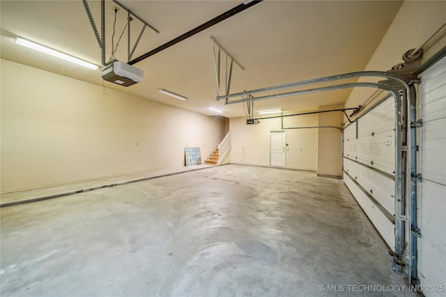 6673 E 60th Pl, Tulsa, OK 74145 - garage featuring a garage door opener