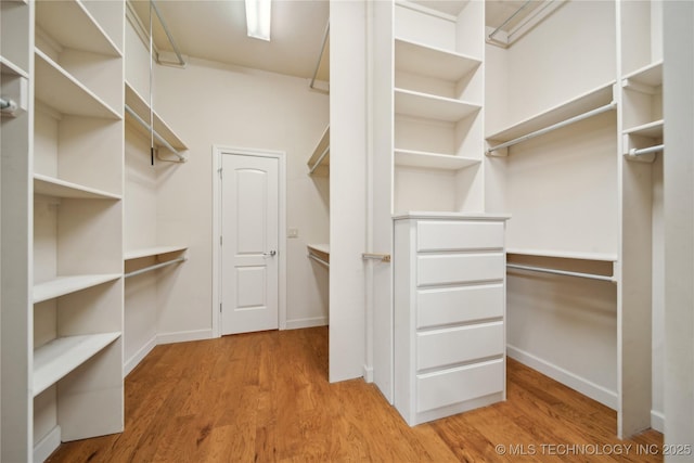 6673 E 60th Pl, Tulsa, OK 74145 - spacious closet with wood finished floors