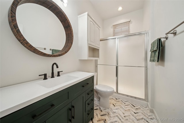 6673 E 60th Pl, Tulsa, OK 74145 - bathroom featuring toilet, vanity, a shower stall, recessed lighting, and baseboards