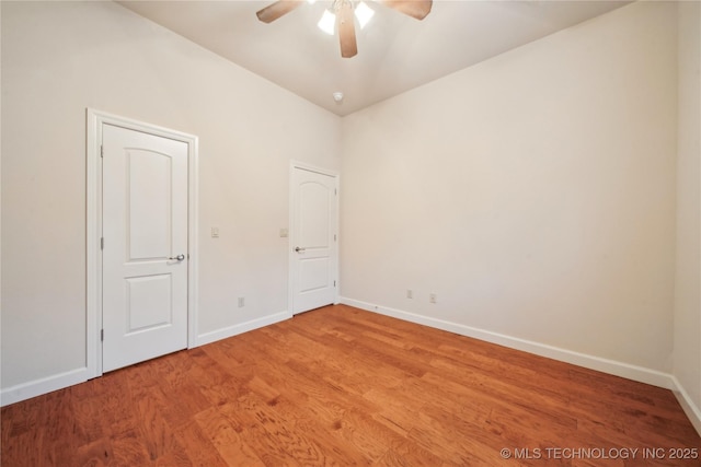 6673 E 60th Pl, Tulsa, OK 74145 - empty room with a ceiling fan, baseboards, and light wood-style floors