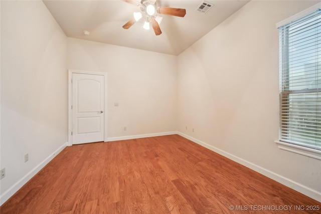 6673 E 60th Pl, Tulsa, OK 74145 - empty room with light wood finished floors, ceiling fan, baseboards, and healthy amount of natural light