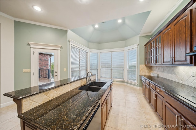 6673 E 60th Pl, Tulsa, OK 74145 - kitchen with stainless steel dishwasher, a sink, tasteful backsplash, light tile patterned floors, and recessed lighting