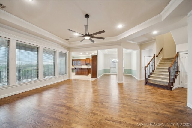 6673 E 60th Pl, Tulsa, OK 74145 - unfurnished living room featuring ceiling fan, crown molding, stairs, wood finished floors, and baseboards