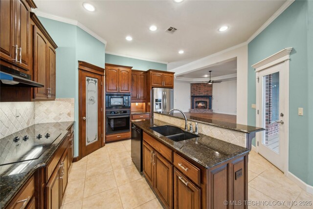 6673 E 60th Pl, Tulsa, OK 74145 - kitchen with a sink, black appliances, crown molding, under cabinet range hood, and decorative backsplash