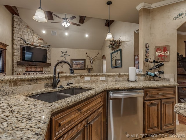 kitchen featuring arched walkways, ceiling fan, stainless steel dishwasher, and a sink