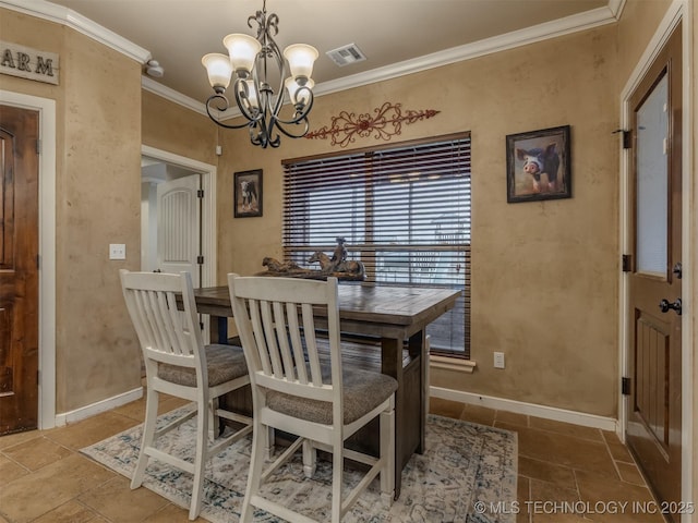 dining room featuring visible vents, baseboards, a chandelier, and crown molding