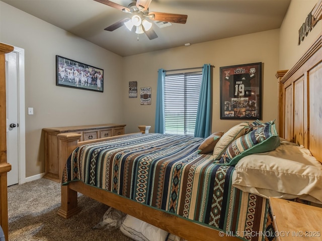 carpeted bedroom with baseboards and a ceiling fan