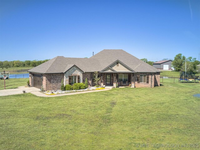 view of front of home with concrete driveway, a front lawn, fence, a porch, and a garage