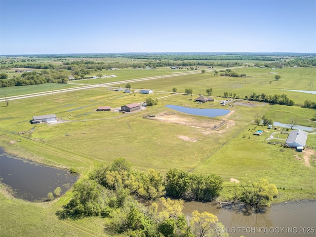 bird's eye view featuring a water view and a rural view