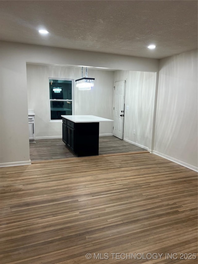 4232 N Hartford Ave, Tulsa, OK 74106 - unfurnished room featuring recessed lighting, a textured ceiling, baseboards, and dark wood finished floors