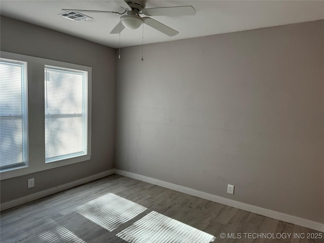 218 SW B, Ardmore, OK 73401 - unfurnished room with a ceiling fan, light wood-type flooring, healthy amount of natural light, and baseboards