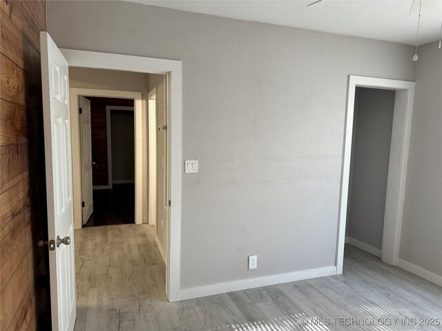 218 SW B, Ardmore, OK 73401 - spare room featuring light wood-style floors and baseboards