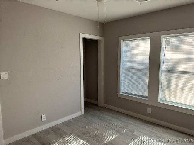 218 SW B, Ardmore, OK 73401 - spare room featuring baseboards and wood finished floors