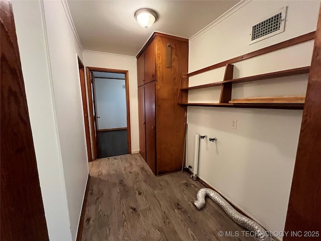 1421 E 50th St S, Tulsa, OK 74105 - laundry room with wood finished floors, ornamental molding, and baseboards