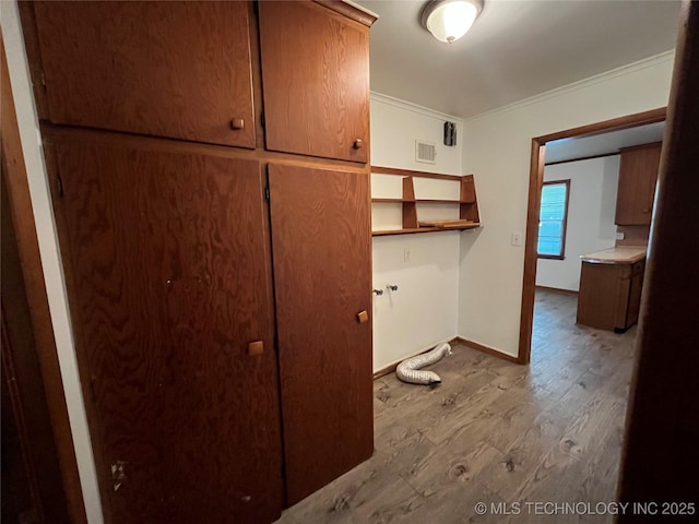 1421 E 50th St S, Tulsa, OK 74105 - laundry room featuring wood finished floors, crown molding, and baseboards