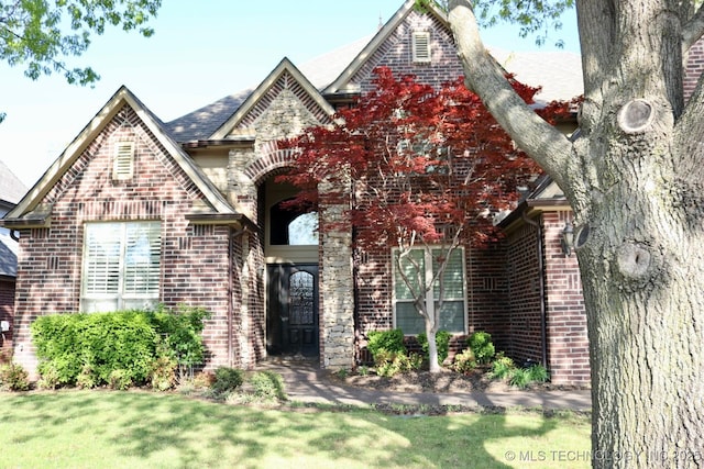10213 S 88th E Ave, Tulsa, OK 74133 - view of front facade featuring brick siding and a front lawn