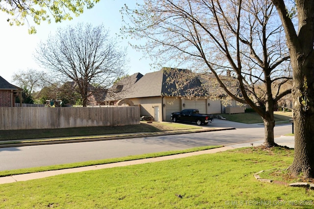 10213 S 88th E Ave, Tulsa, OK 74133 - view of asphalt street featuring sidewalks and curbs