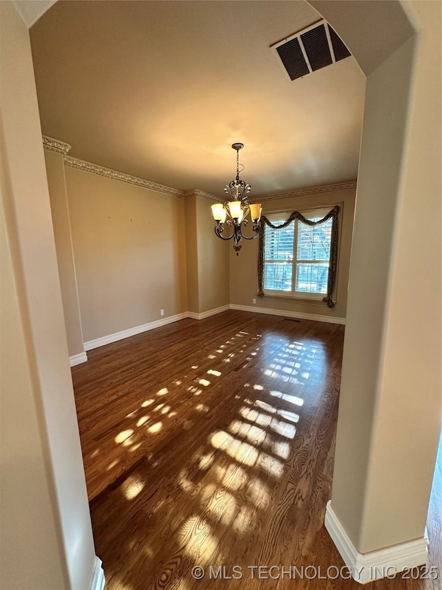 10213 S 88th E Ave, Tulsa, OK 74133 - unfurnished dining area with wood finished floors, a chandelier, and arched walkways