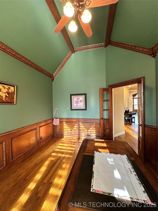 10213 S 88th E Ave, Tulsa, OK 74133 - unfurnished dining area featuring wood finished floors, wainscoting, ceiling fan, high vaulted ceiling, and beamed ceiling