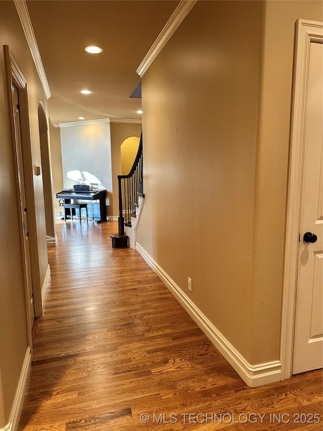 10213 S 88th E Ave, Tulsa, OK 74133 - hallway with arched walkways, ornamental molding, recessed lighting, wood finished floors, and stairway