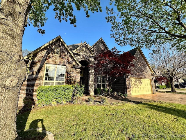 10213 S 88th E Ave, Tulsa, OK 74133 - view of front facade with brick siding, driveway, and a front lawn