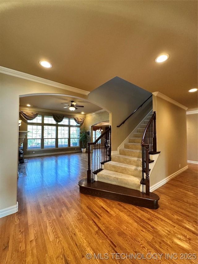 10213 S 88th E Ave, Tulsa, OK 74133 - staircase with crown molding, a ceiling fan, wood finished floors, and recessed lighting